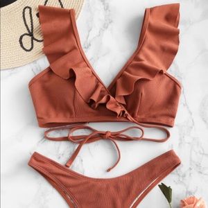 Trendy bathing suit. Top and bottom for sale.